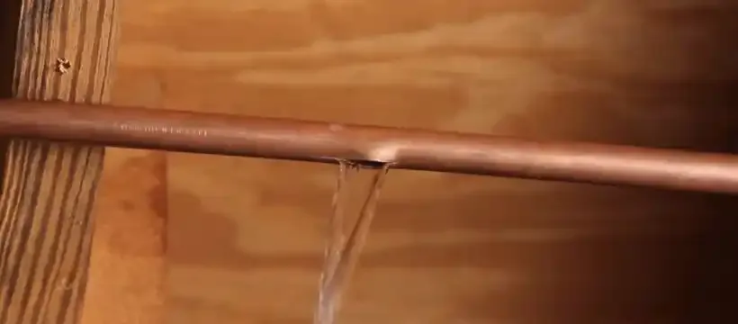Licensed technician performing burst pipe repair for a Franklin, TN home