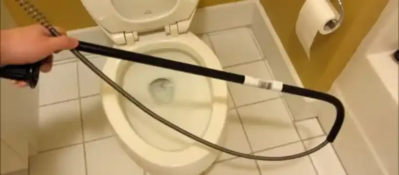 Licensed technician performing clogged toilet repair for a Franklin, TN home