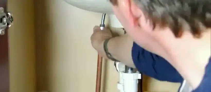 Licensed technician performing plumbing repair for a Franklin, TN home