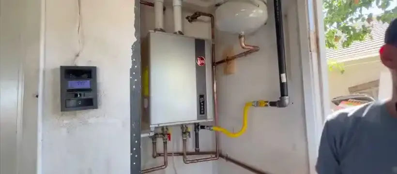 Licensed technician performing water heater installation for a Franklin, TN home