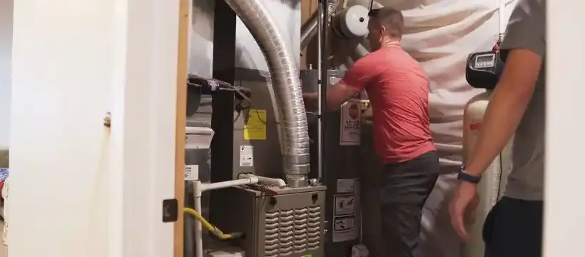Licensed technician performing water heater replacement for a Franklin, TN home